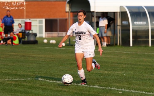 Chasing down the ball.